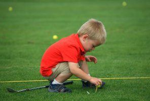 little-boy-on-golf-course