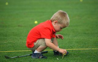 little-boy-on-golf-course